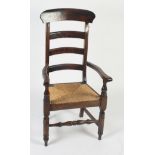 A rush seated country armchair, with three horizontal bar splats,