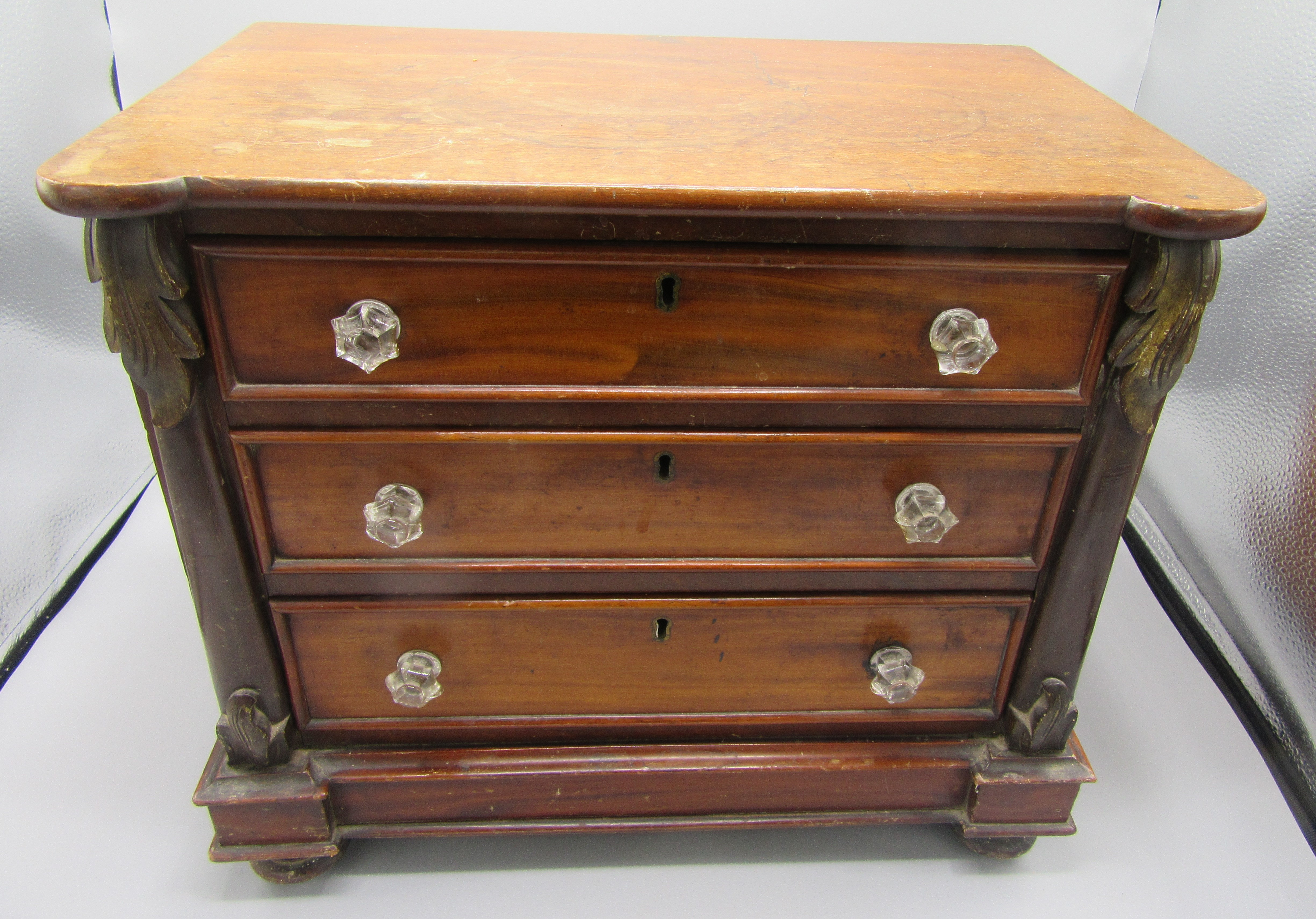 A Victorian mahogany miniature chest of drawers, with three long graduated drawers, - Image 2 of 6