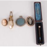 A shell and gilt metal mounted perfume bottle, a cameo brooch, a stick pin,