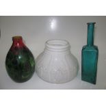 An opaline glass lampshade, diameter 30cm, a coloured glass vase and bottle.
