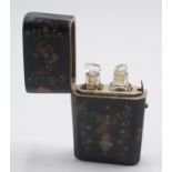 An early 19th century pique perfume case holding original glass bottles with cut glass stoppers,