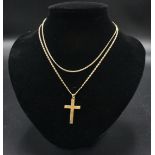 A 9ct gold cross and two chains.