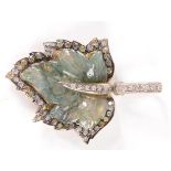 A pendant in high purity gold realistically carved from moss agate with a maple leaf,