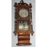 A late Victorian marquetry inlaid walnut wall clock, height 95cm, width 40cm.