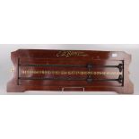 A mahogany snooker scoreboard, inscribed 'E.J. Riley Limited Accrington', 21 x 58cm.