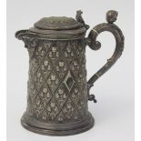A silver plated tankard, the handle surmounted by the head of a child,