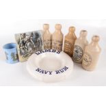 Five stoneware ginger beer bottles, including Launceston and Fowey, a Victorian prattware pot,