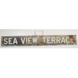 An enamelled street sign, 'Sea View Terrace', 12.5 x 98cm.