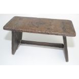 An oak country stool, 19th century, the seat with metal stud inscription 'Victoria, A Veal 31st,