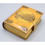 A Mauchline ware photo album, depicting scenes from The Isle of Wight entitled 'West Cowes',