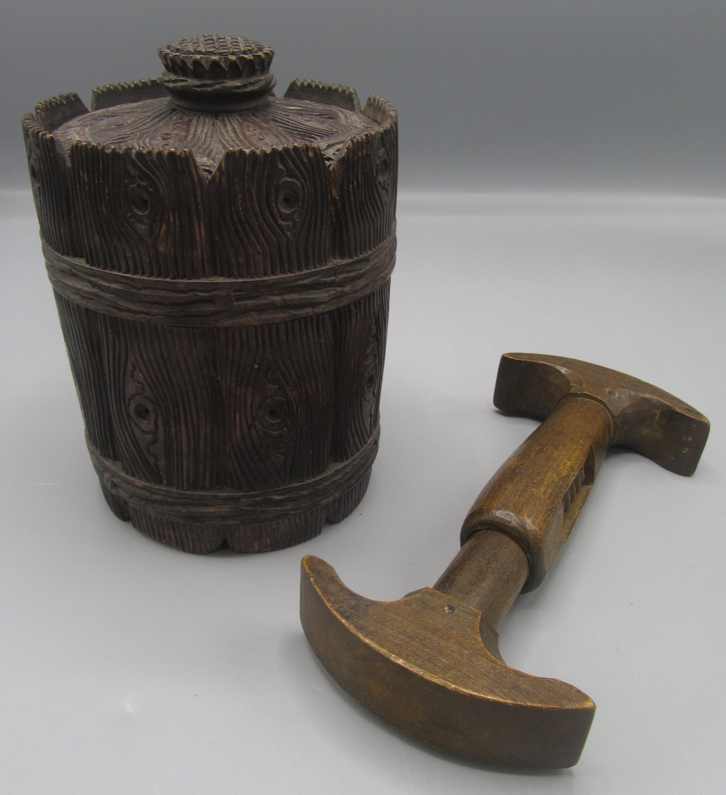 A treen tobacco jar and cover in the form of a barrel,