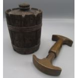 A treen tobacco jar and cover in the form of a barrel,