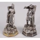 A pair of Russian silver figures, one is of a woman, she carries a hopper on her back,