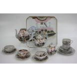 A Japanese porcelain tea service and tray, size of tray 36 x 35.