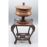 A mazer cup and cover, height 15cm and a small mahogany hardwood stand, height 17cm.