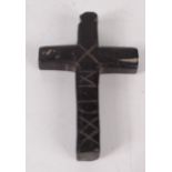 A black Scottish hardstone cross, apparently dated 1550, 65 x 44mm.