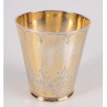 A French silver gilt beaker with chased decoration inscribed to the underneath 28th November 1874,