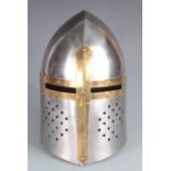 A knight's steel and brass bound helmet, height 33cm.
