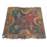 A Turkish Ushak rug, the indigo field with a central green medallion,