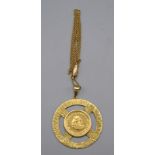 A South African 18ct gold pendant at the centre a medallion 14g, on 9ct gold chain.