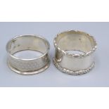 Two silver napkin rings.