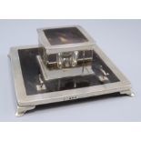 A silver and tortoiseshell inkstand by Mappin & Webb London, 1929, engine turned on bracket feet,