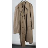 An Aquascutum of London at Harrods pale brown gentleman's raincoat, size medium, length 110cm.