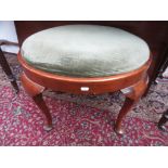 A George III style mahogany stool, with a padded drop in seat, on cabriole legs with pad feet,