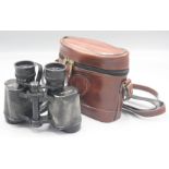 A pair of Asahi Pentax binoculars, 8 x 30, serial no. 5005282, in a brown leather case.