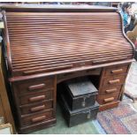 An oak roll top pedestal desk, early 20th century,