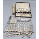 A set of six Dutch silver coffee spoons with engraved decoration together with six fish knives and