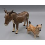 A Beswick model of a donkey, height 13.5cm, length 17.5cm and a Beswick dog, height 7.5cm, length 8.