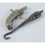 A miniature Austrian nickel pistol and a small silver button hook.