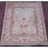 A Ziegler rug, West Persia, the ivory field with palmettes, scrolling vines, flowerheads and leaves,