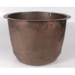 A large circular copper wash bowl, height 32cm, diameter 47cm.