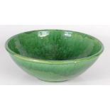 A large Brannam Barum W.Devon green glazed pottery bowl, height 14cm, diameter 40.5cm.