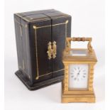 A miniature brass carriage clock, the white enamel dial inscribed Hall & Co, the movement signed 'G.