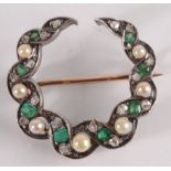 An emerald, diamond and pearl crescent brooch.