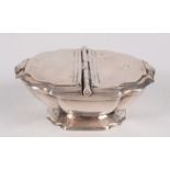 A double silver spice box in 18th century continental style with hinged lids and shell thumb pieces,