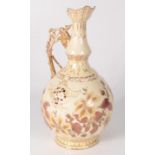 A Zsolnay Pecs Hungarian pottery ewer, with gilt decorated handle and floral decoration to the body,