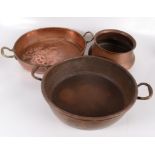 A Victorian circular copper pan, diameter 41cm, height 11cm, an oval copper pan, 35 x 42cm,