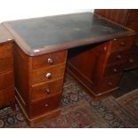 A Victorian mahogany pedestal desk, the rectangular moulded top above an arrangement of drawers,