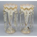 A pair of Victorian gilt decorated milk glass lustres, height 31.5cm, diameter of top 13.5cm.