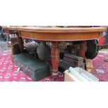 A Victorian oak extending dining table, with turned and fluted tapering supports, height 74cm,