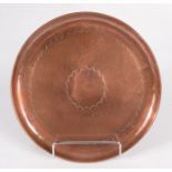 A Newlyn circular copper tray, impressed mark, diameter 22.5cm.