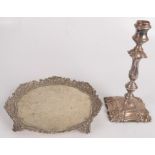 A silver plated salver, 19th century, on four foliate moulded feet, diameter 25.