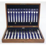 A set of Walker & Hall Sheffield silver plated knives and forks,