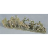 A Chinese mottled green jade carving of a tree log raft, 20th century,