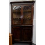 A George III oak standing corner cupboard,