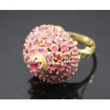 An 18ct gold dress ring set a cone of rubies.